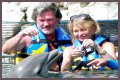 Goldie Hawn Rocks a Red Swimsuit at Age 67, Feeds Dolphins With Kurt Russell